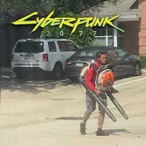 The meme is a photo of a man in a red shirt and shorts, walking down a street while carrying a leaf blower and a backpack. The image is captioned "Cyberpunk 2077" in a futuristic font, which is ironic because the scene is actually a mundane suburban setting. The meme pokes fun at the idea that a game like Cyberpunk 2077, which is known for its futuristic and high-tech themes, can be inspired by something as ordinary and mundane as a leaf blower.